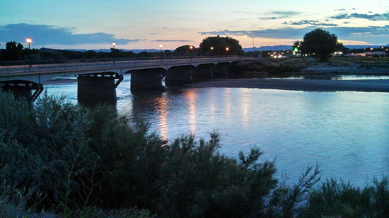 The Green River and its bridge at dusk in Green River, Utah