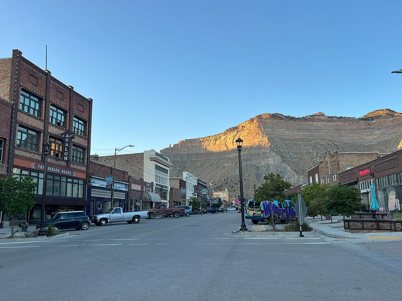 Historic Main Street in Helper, Utah, beneath the surrounding cliffs