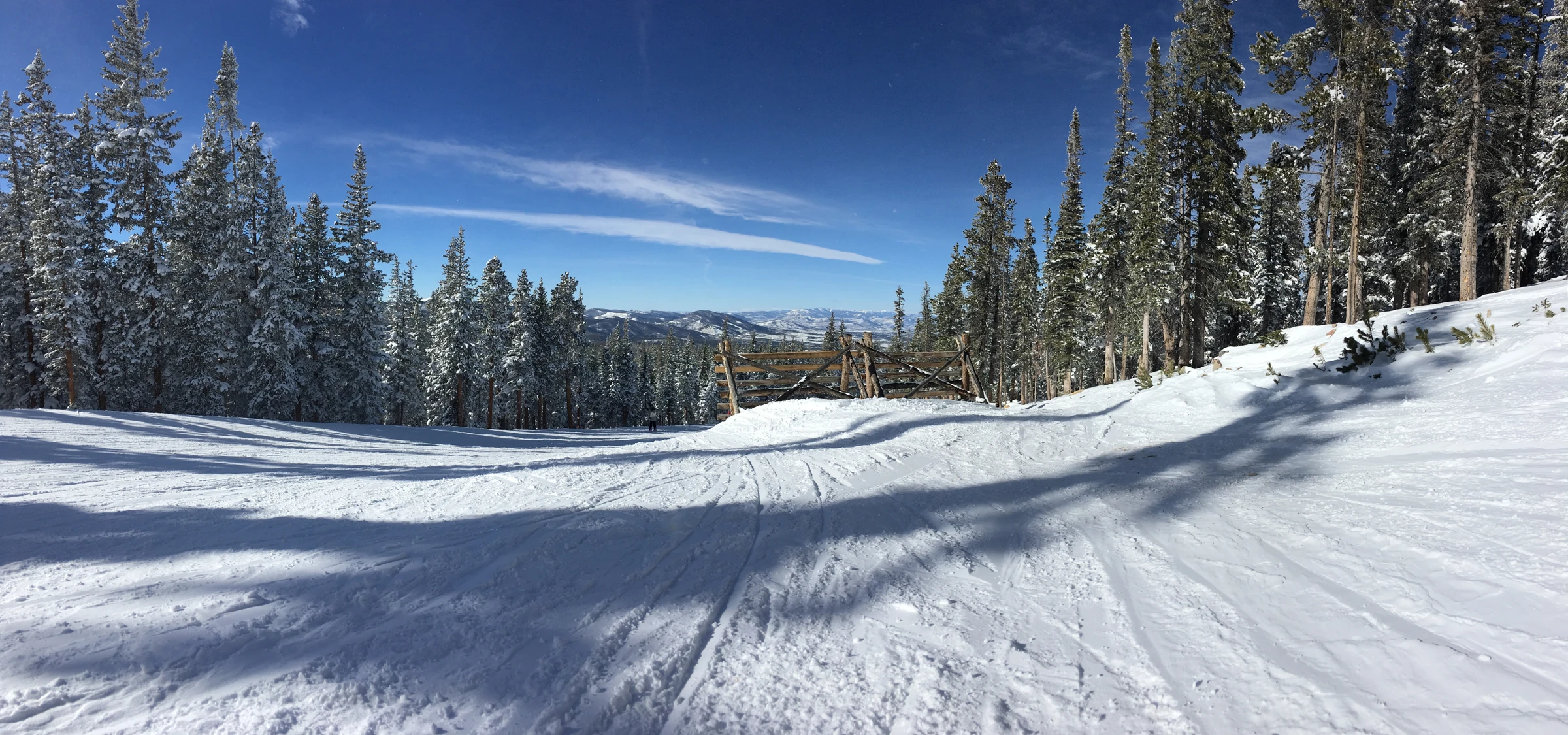 Snow-covered ski slopes and evergreen trees at Winter Park Resort, Colorado